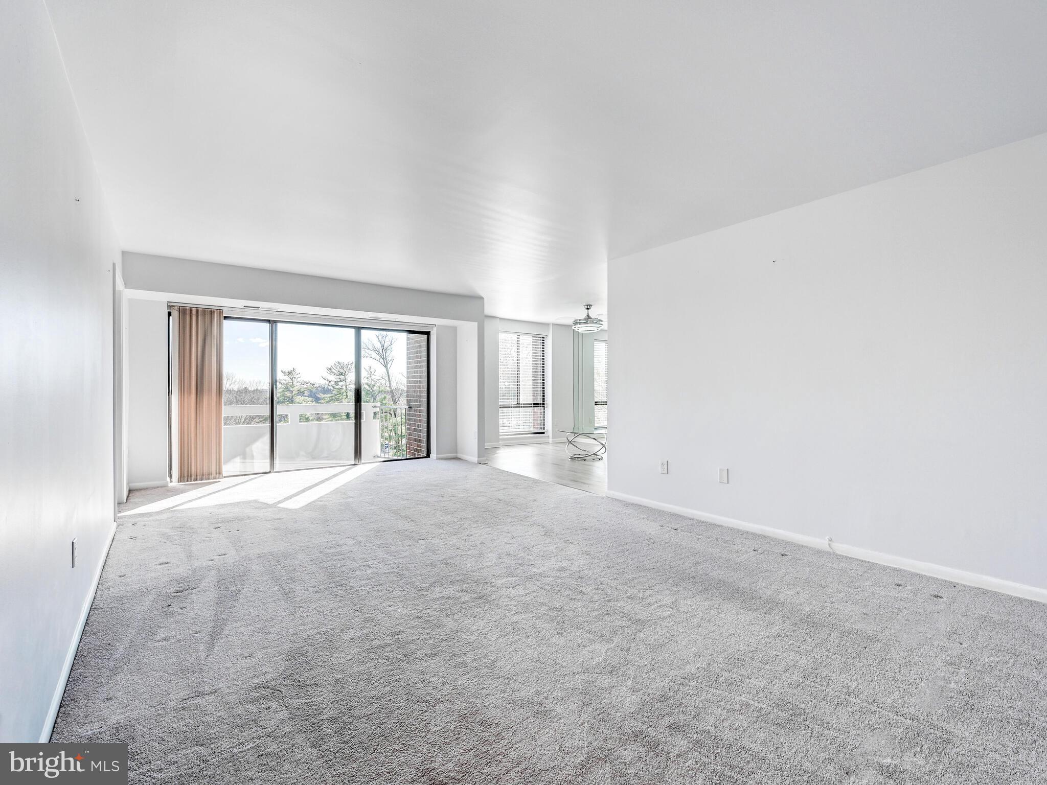 7 Slade Avenue, Unit 718 Pikesville, MD 21208 - Photo 44 of 58 a view of an empty room with a window