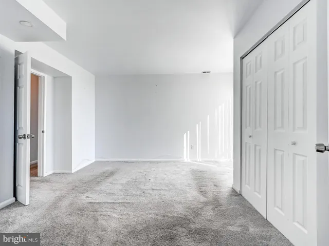 a view of an empty room and window
