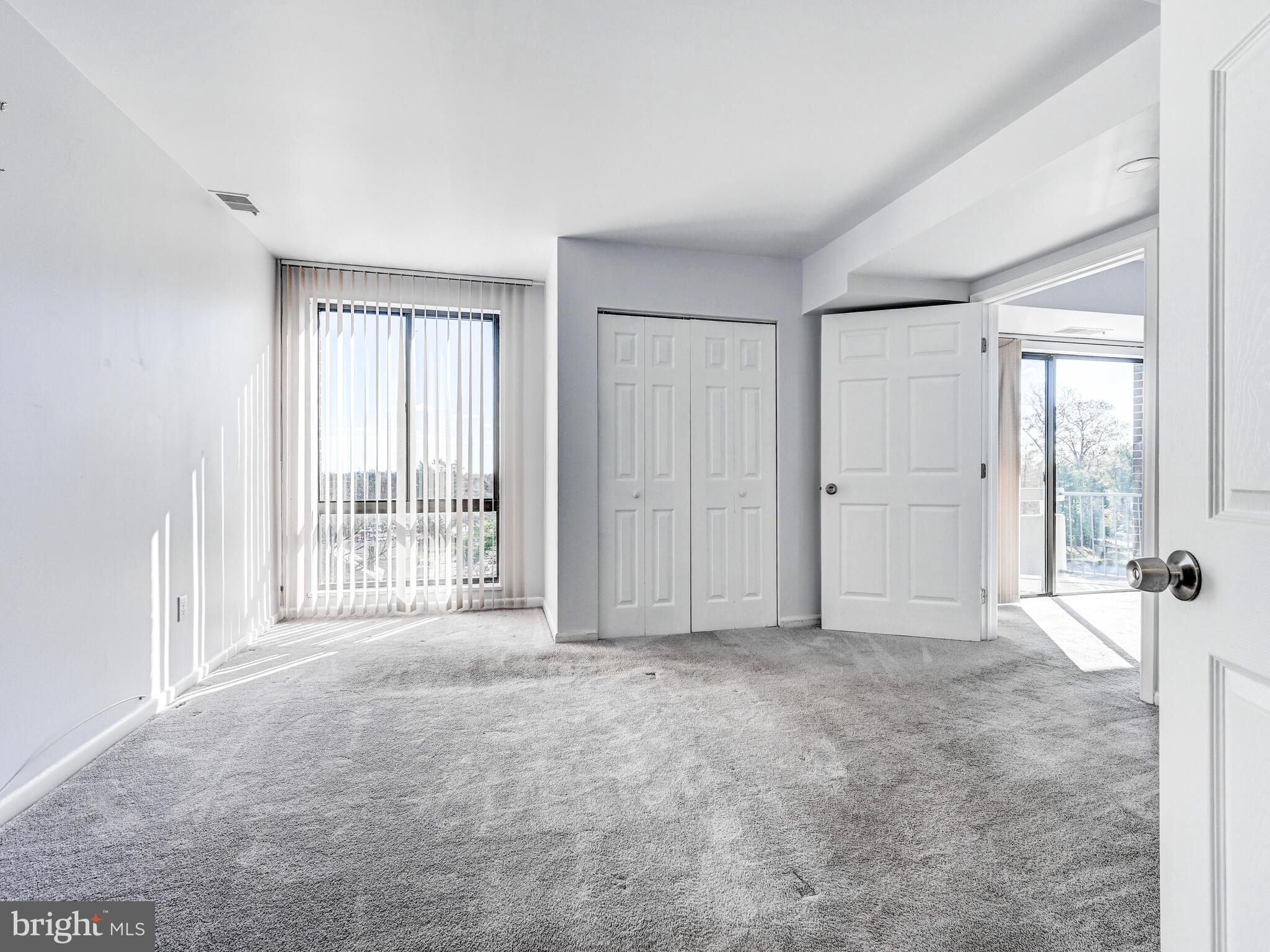 7 Slade Avenue, Unit 718 Pikesville, MD 21208 - Photo 50 of 58 a view of an empty room with a window