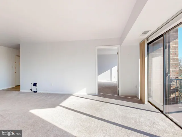 a view of a swimming pool with an outdoor space and seating area