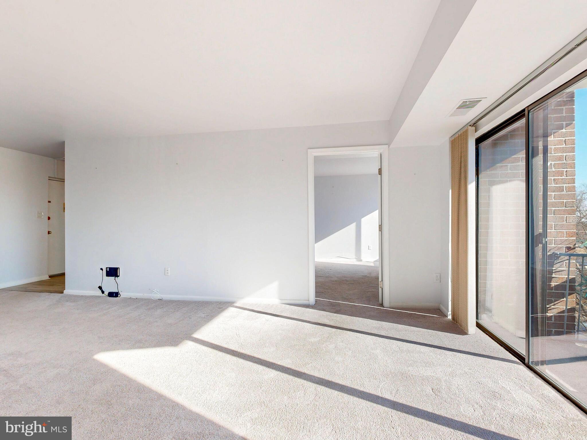 7 Slade Avenue, Unit 718 Pikesville, MD 21208 - Photo 53 of 58 a view of an empty room and window