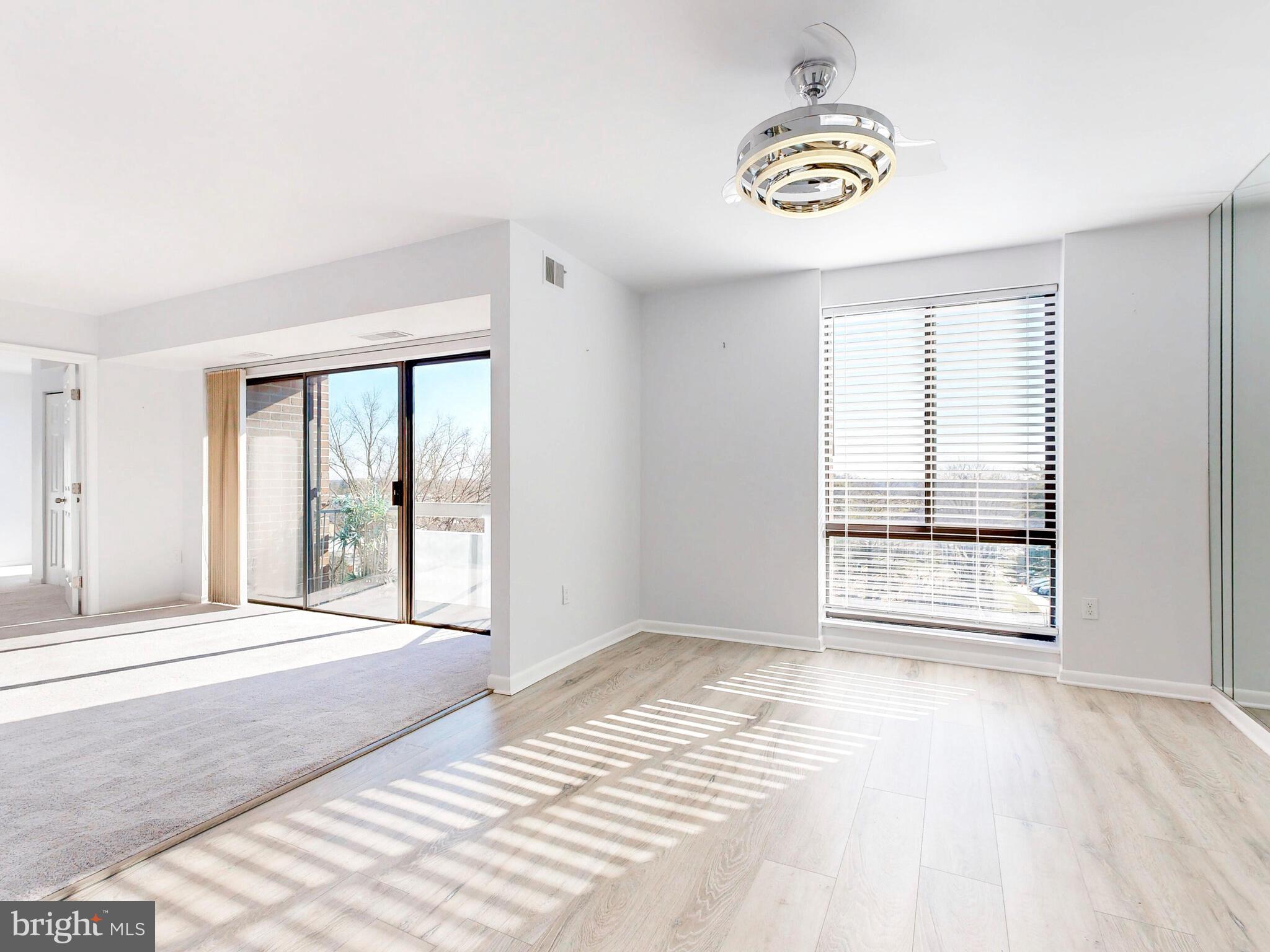 7 Slade Avenue, Unit 718 Pikesville, MD 21208 - Photo 55 of 58 a view of an empty room with a window