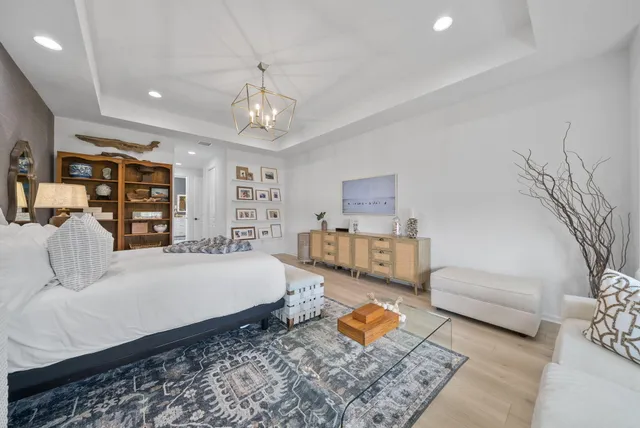 a bathroom with a bathtub sink vanity granite and a shower