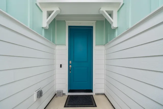 a view of hallway with wooden floor