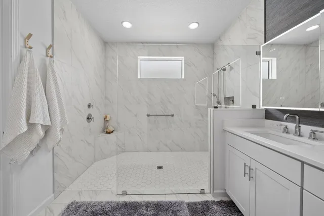 a living room with furniture and a book shelf