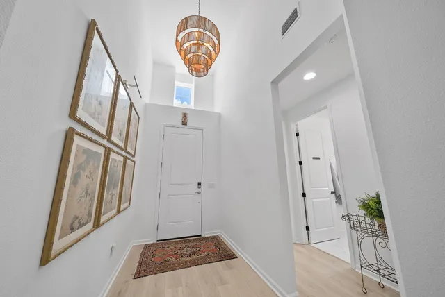 a bathroom with a shower sink vanity mirror and toilet