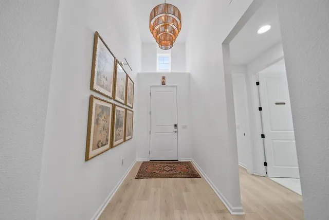 a living room with furniture and potted plant