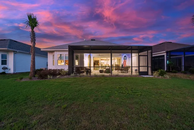 a dining room with furniture window and wooden floor