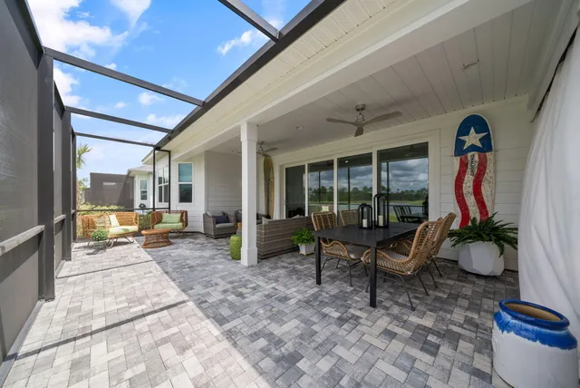 a balcony with furniture and garden view
