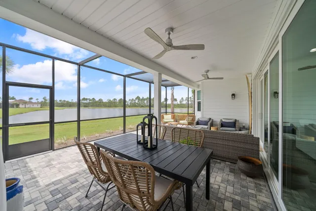 a view of a swimming pool with a yard