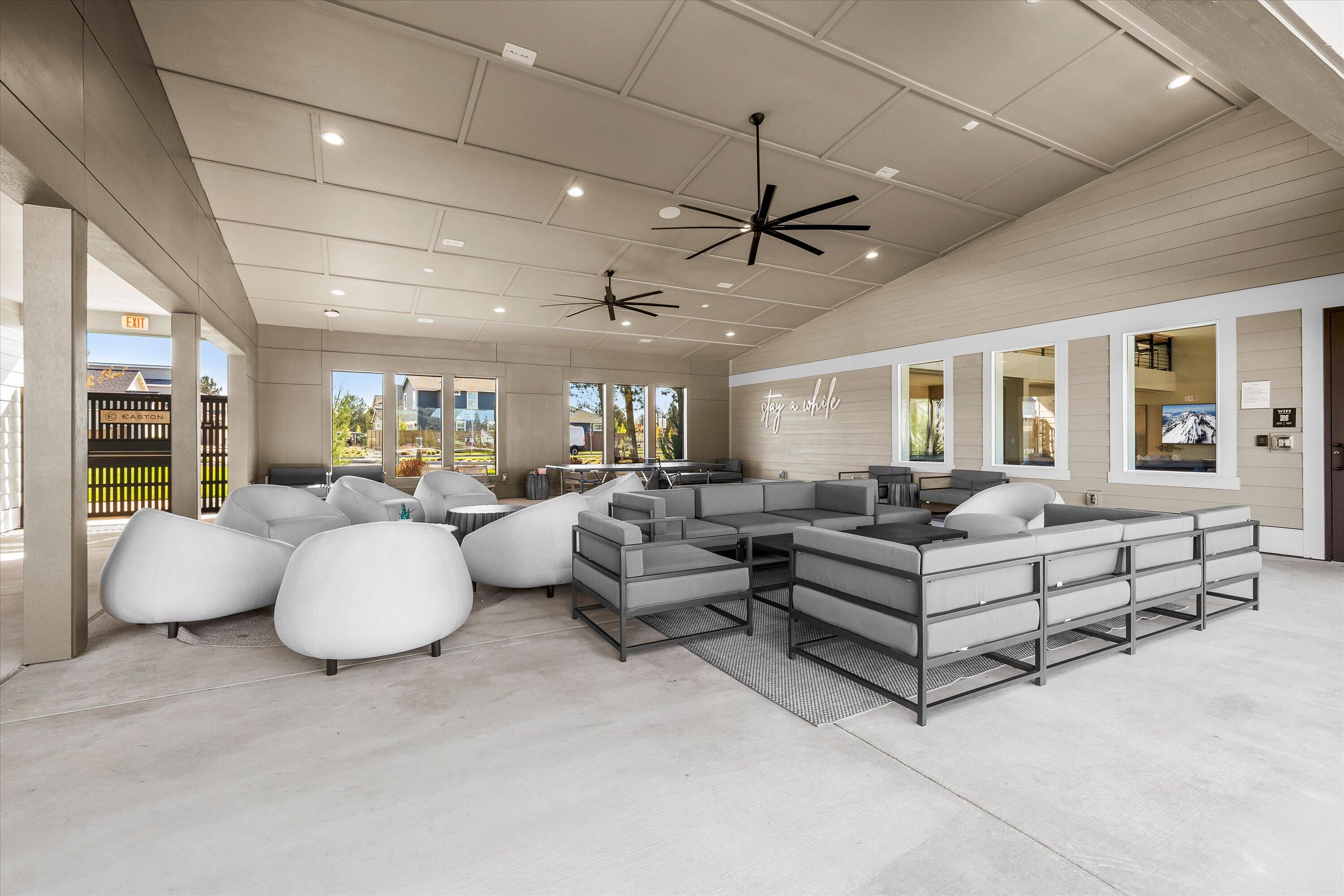 60903 Southeast Epic Place Bend, OR 97702 - Photo 43 of 48 a living room with furniture and a chandelier