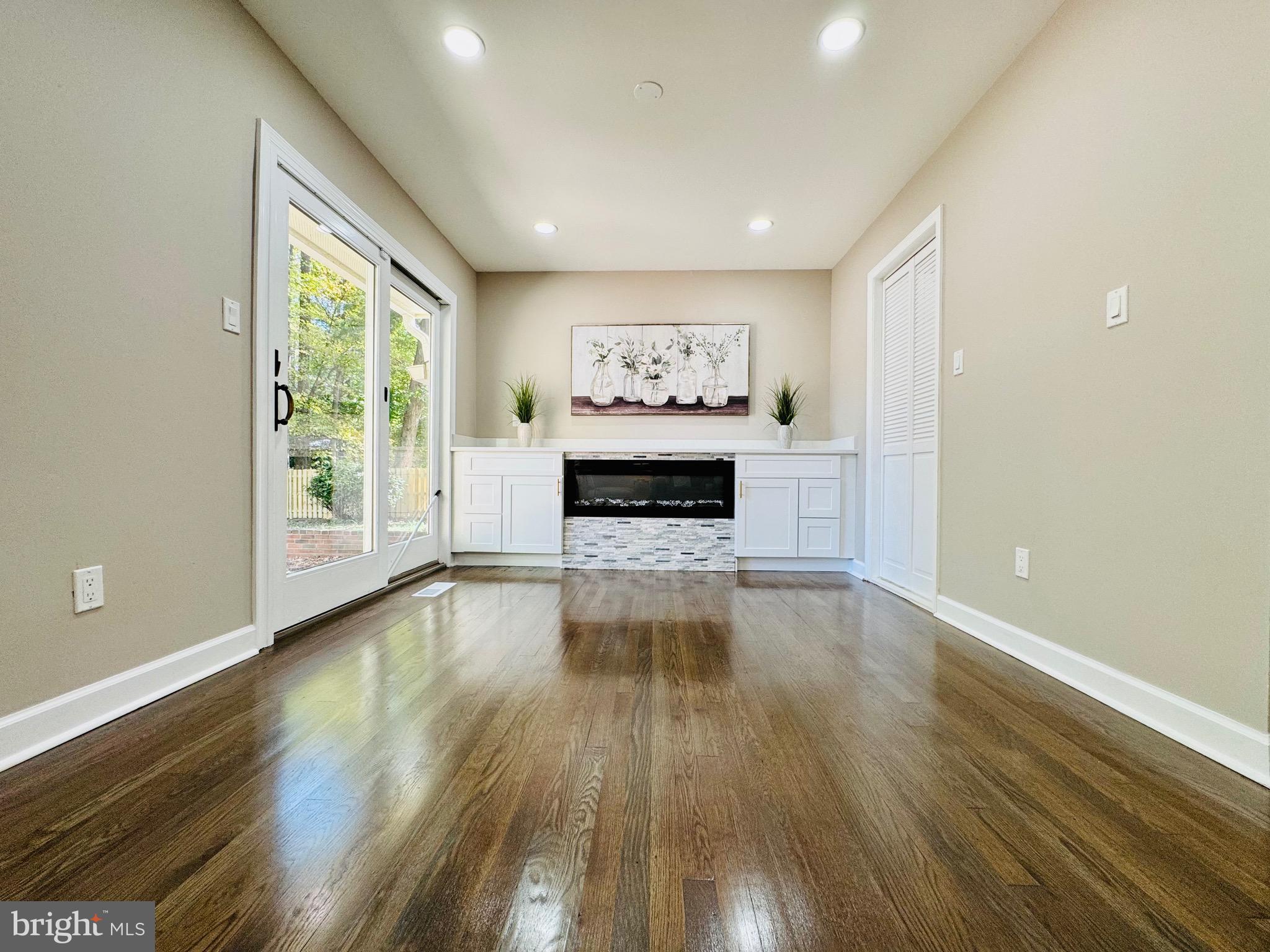 12306 Dendron Place Fort Washington, MD 20744 - Photo 16 of 48 a view of an empty room with window wooden floor and front door