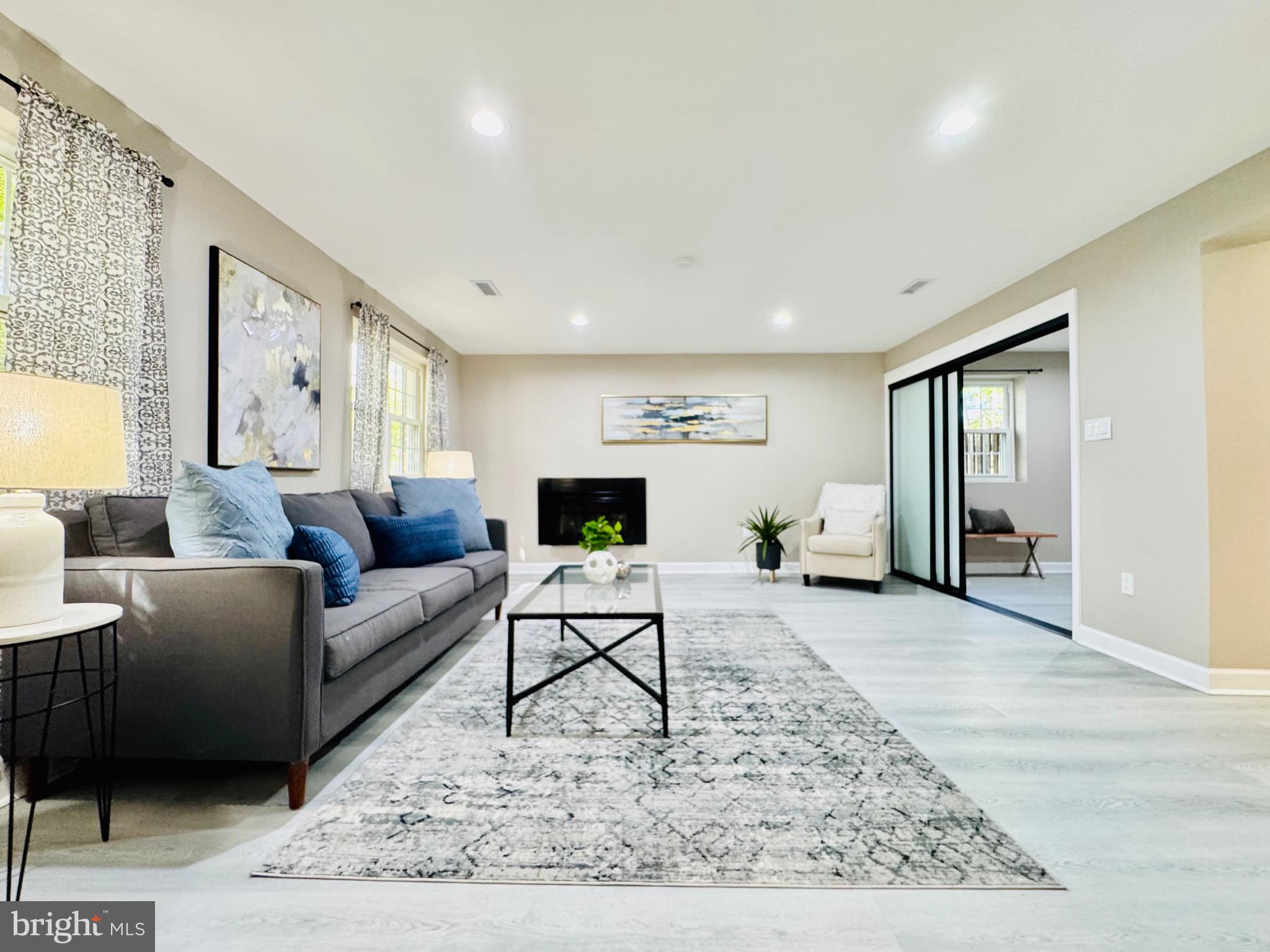 12306 Dendron Place Fort Washington, MD 20744 - Photo 20 of 48 a living room with furniture and a flat screen tv