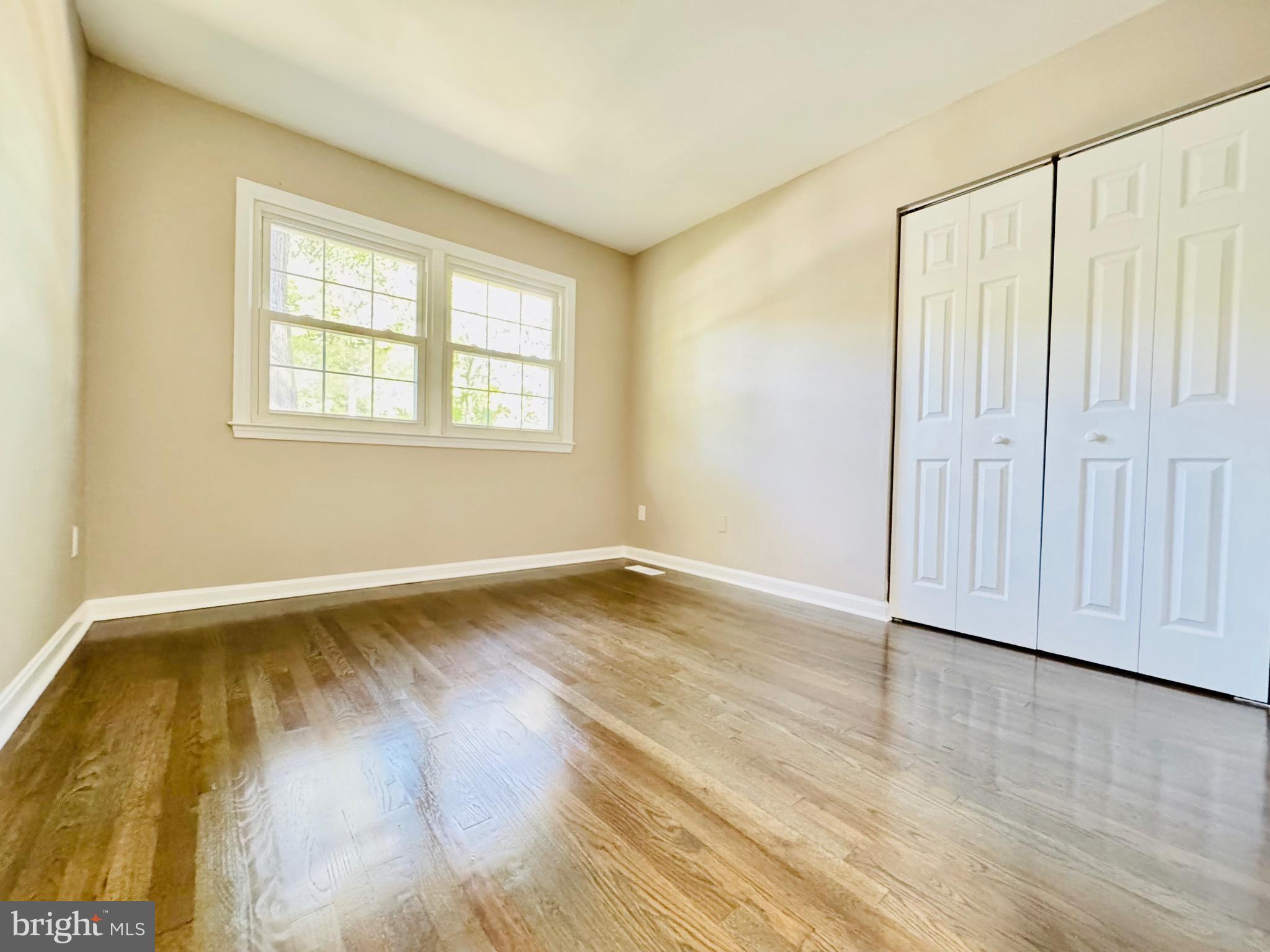 12306 Dendron Place Fort Washington, MD 20744 - Photo 24 of 48 a view of an empty room with wooden floor and a window