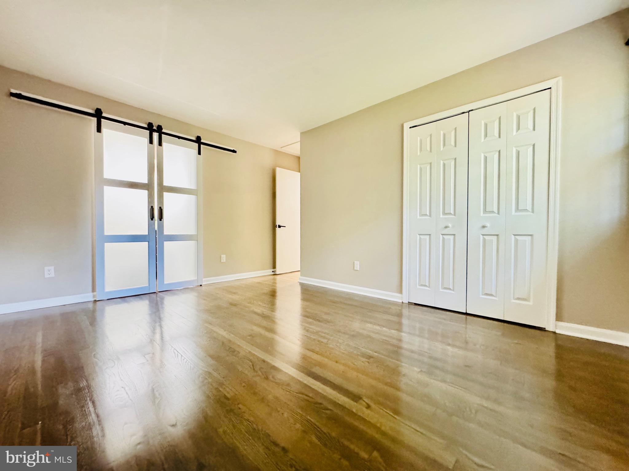 12306 Dendron Place Fort Washington, MD 20744 - Photo 27 of 48 a view of an empty room with wooden floor and a window