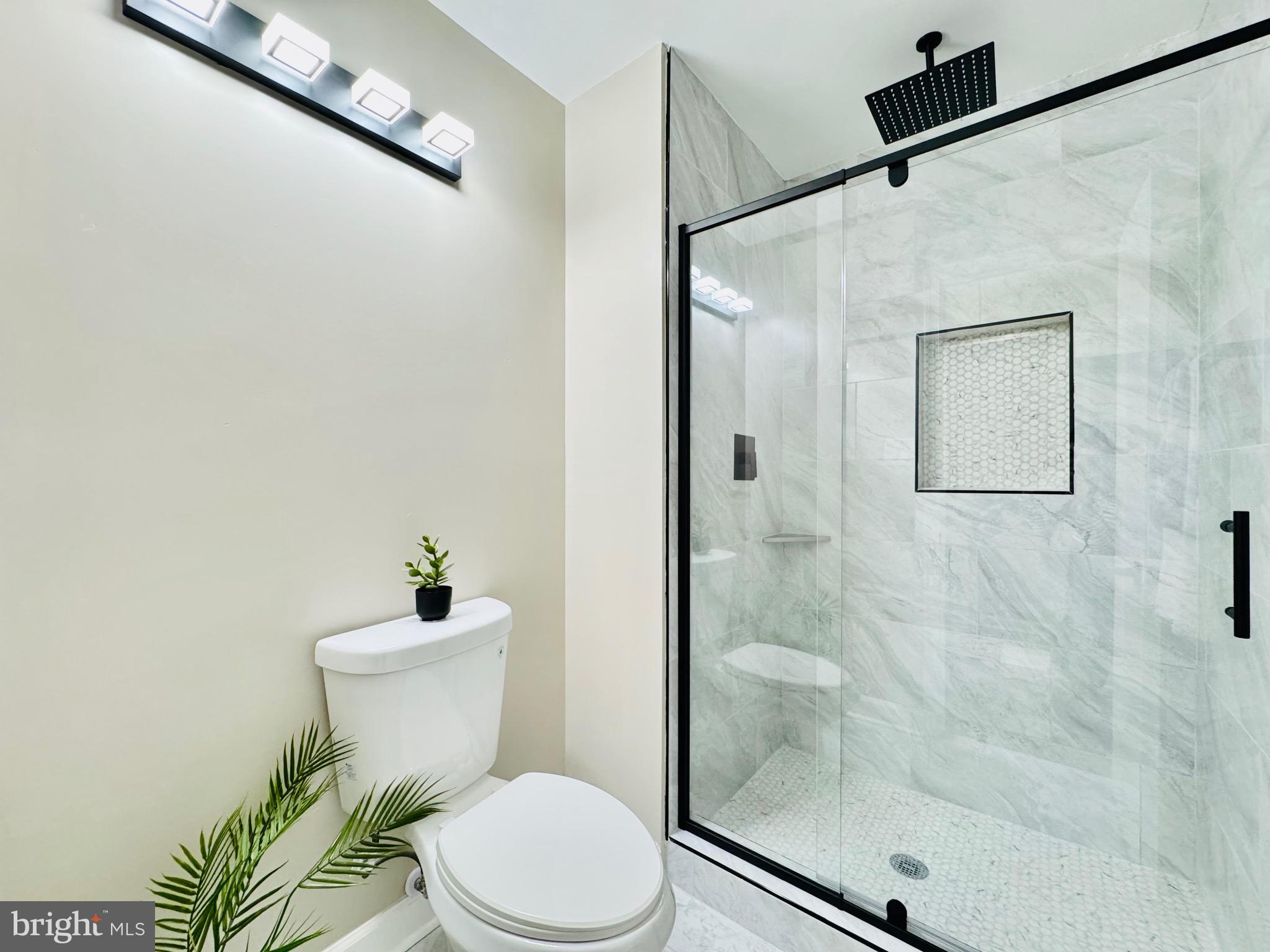12306 Dendron Place Fort Washington, MD 20744 - Photo 29 of 48 a white toilet sitting next to a bathroom sink