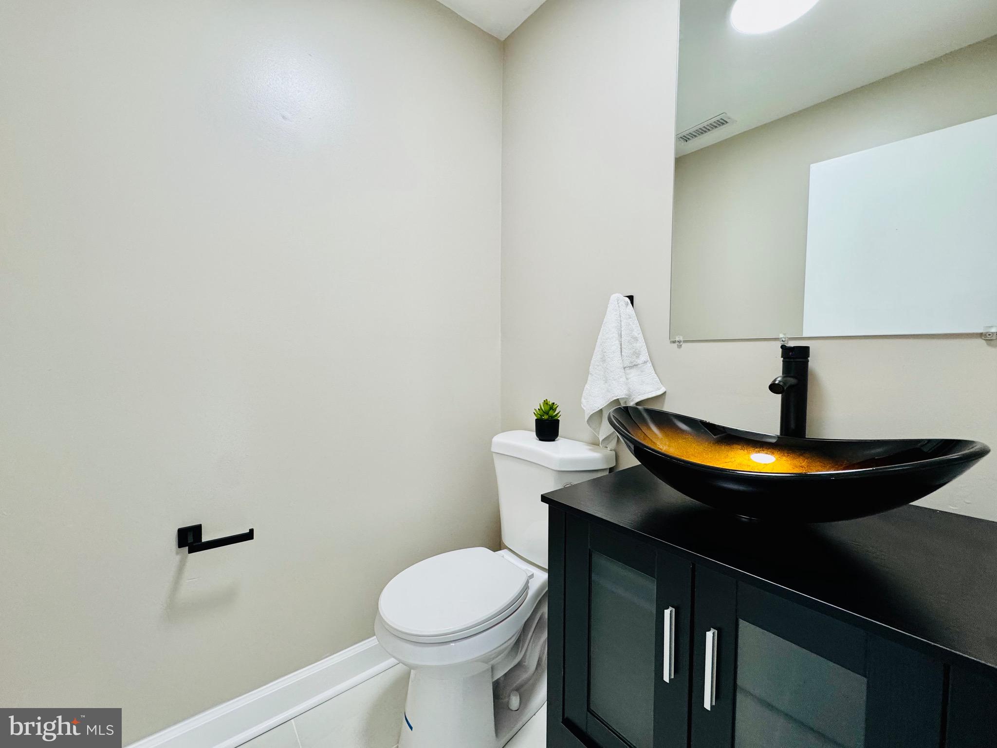 12306 Dendron Place Fort Washington, MD 20744 - Photo 34 of 48 a bathroom with a sink and a toilet