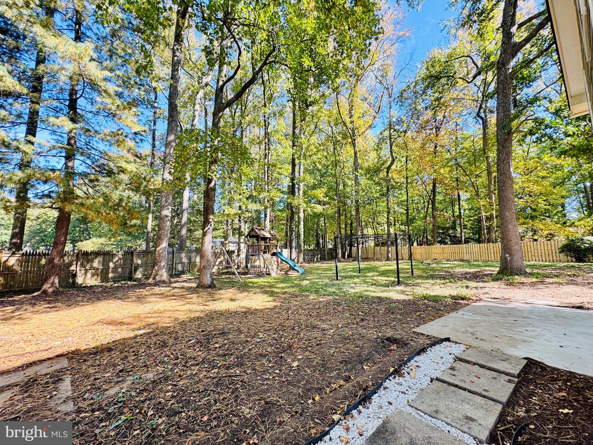 12306 Dendron Place Fort Washington, MD 20744 - Photo 43 of 48 a backyard of a house with trees and plants
