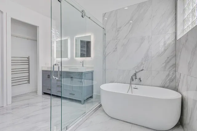 a white bath tub sitting next to a window