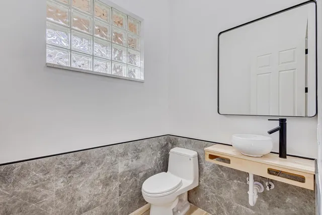 a view of a swimming pool with outdoor seating