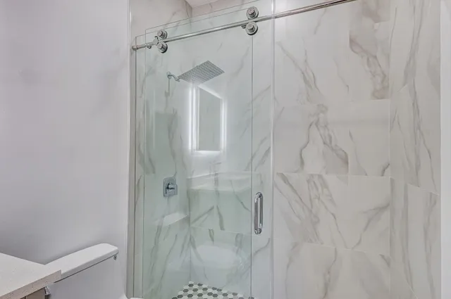 a front view of a house with a big yard and a fountain