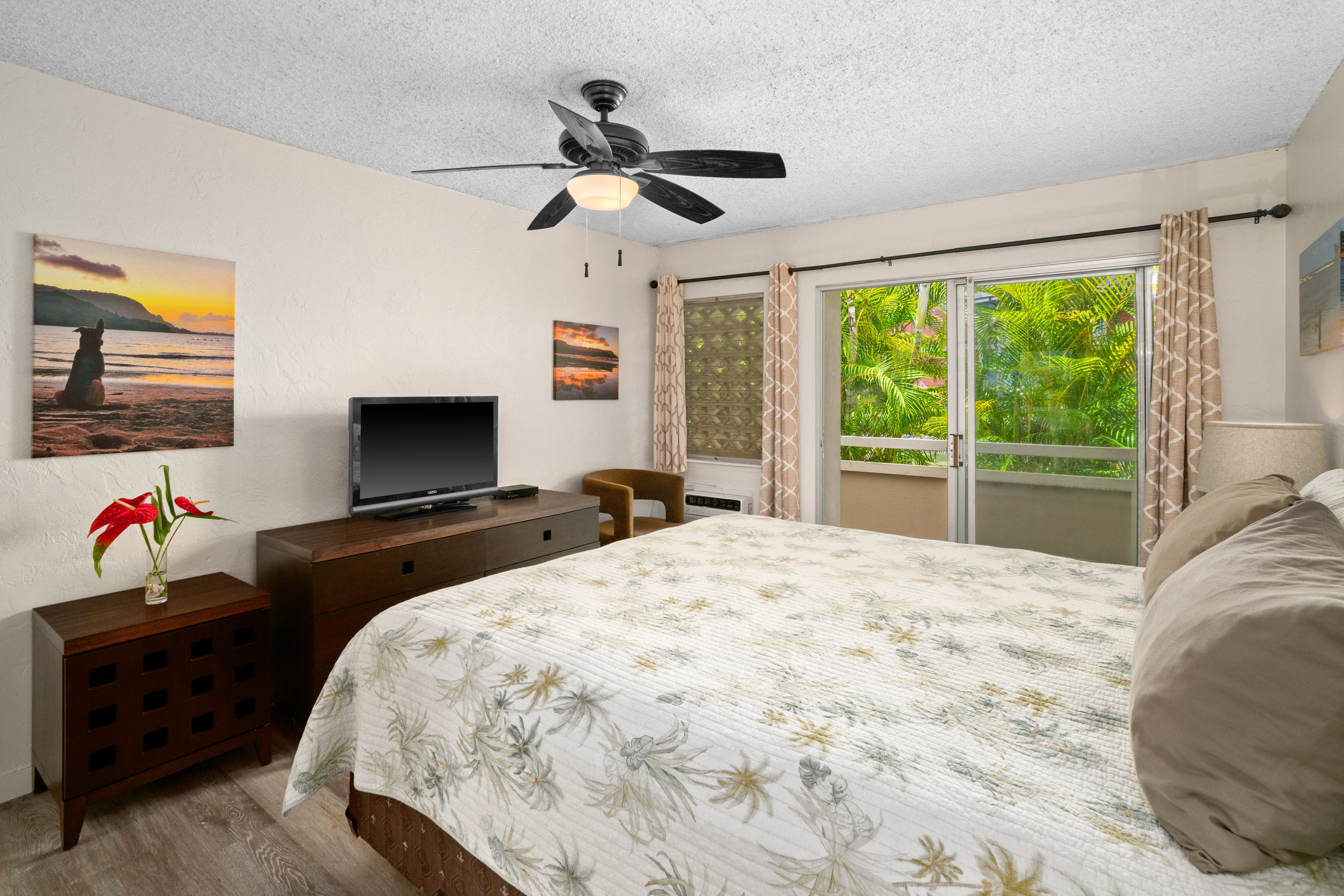 525 Aleka Loop, Unit A3 Kapaa, HI 96746 - Photo 10 of 18 a bedroom with a bed and a flat tv screen