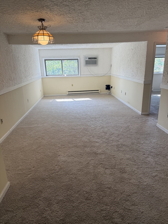 310 Codman Hill Road, Unit 34D Boxborough, MA 01719 - Photo 6 of 17 a view of room with window