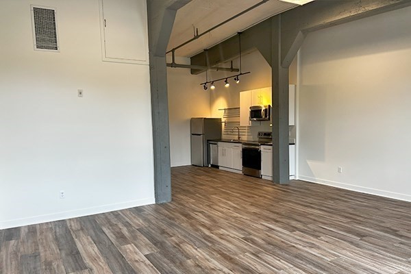 45 High Street, Unit 4 North Andover, MA 01845 - Photo 3 of 17 a view of a kitchen with wooden floor