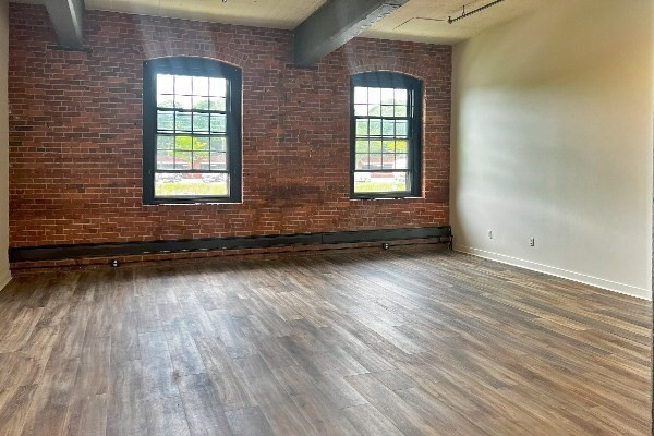 45 High Street, Unit 4 North Andover, MA 01845 - Photo 5 of 17 a view of a room with wooden floor and two window