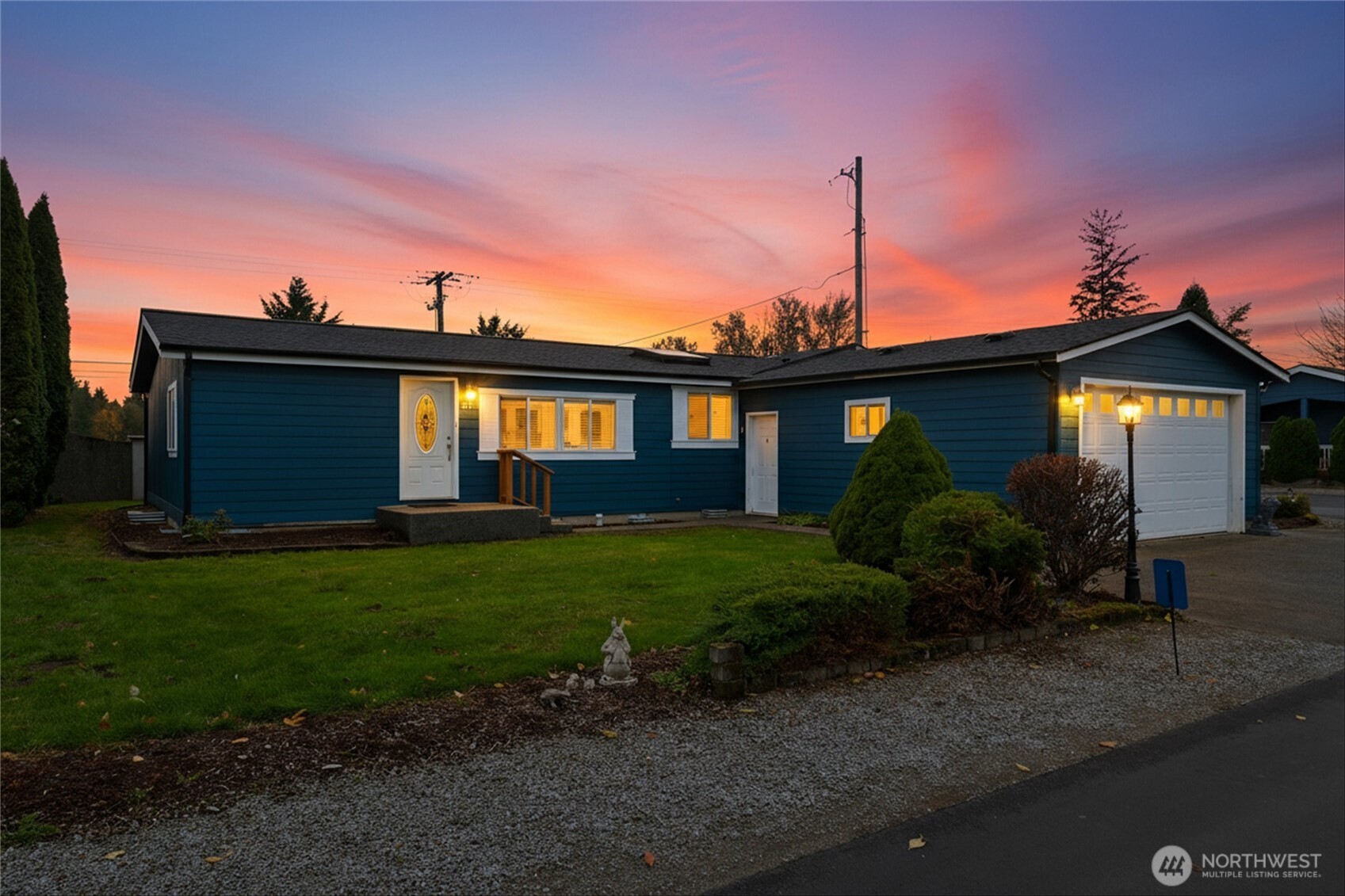 107 South Pass Road, Unit 23 Nooksack, WA 98276 - Photo 2 of 23 a front view of a house with garden