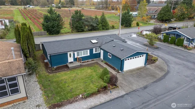 an aerial view of a house with a garden