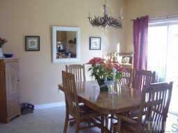 7004 Spanglers Spring Way Raleigh, NC 27610 - Photo 3 of 6 a view of a dining room with furniture and window