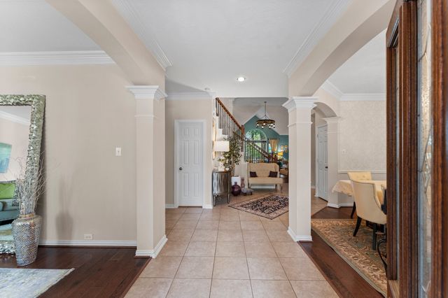 a hallway with white furniture and bedroom view