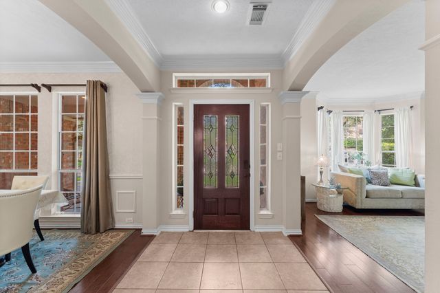a living room with furniture and windows
