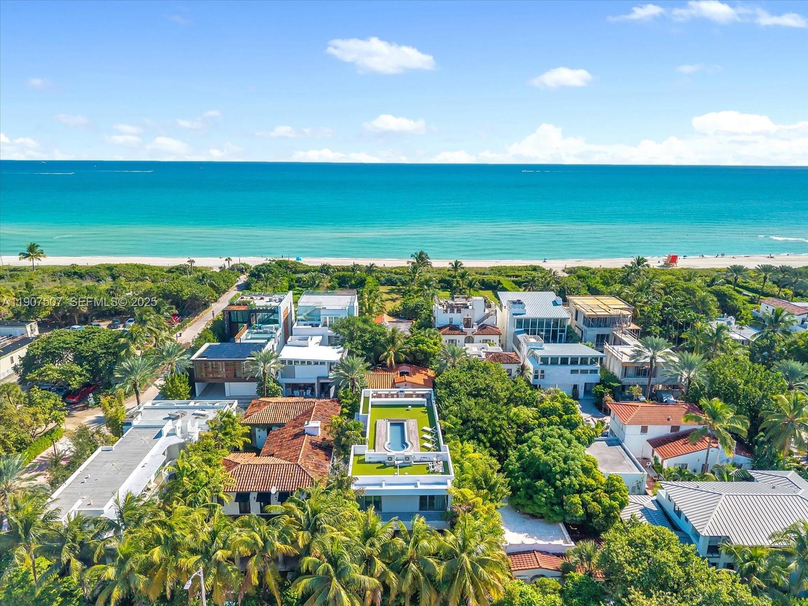 7830 Atlantic Way Miami Beach, FL 33141 - Photo 1 of 34 an aerial view of a building with an outdoor space and seating