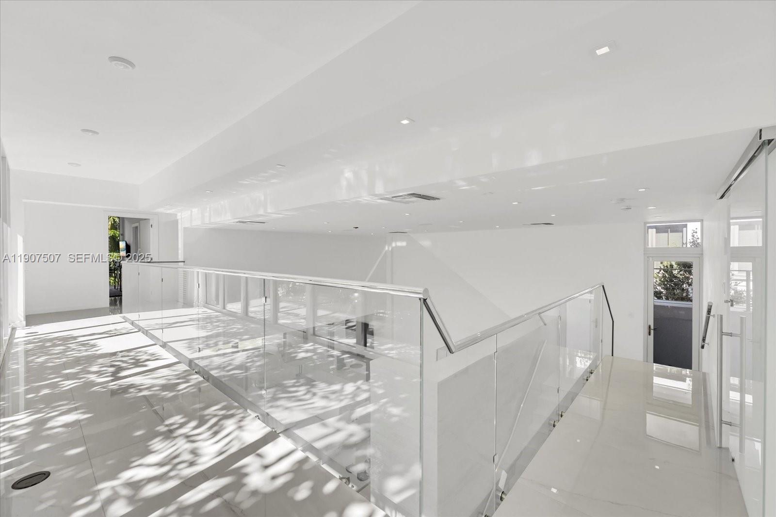 7830 Atlantic Way Miami Beach, FL 33141 - Photo 12 of 34 a view of a hallway with a furniture