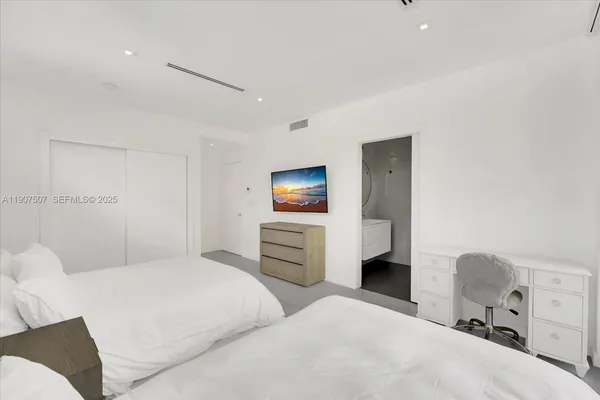 a bedroom with a bed and furniture