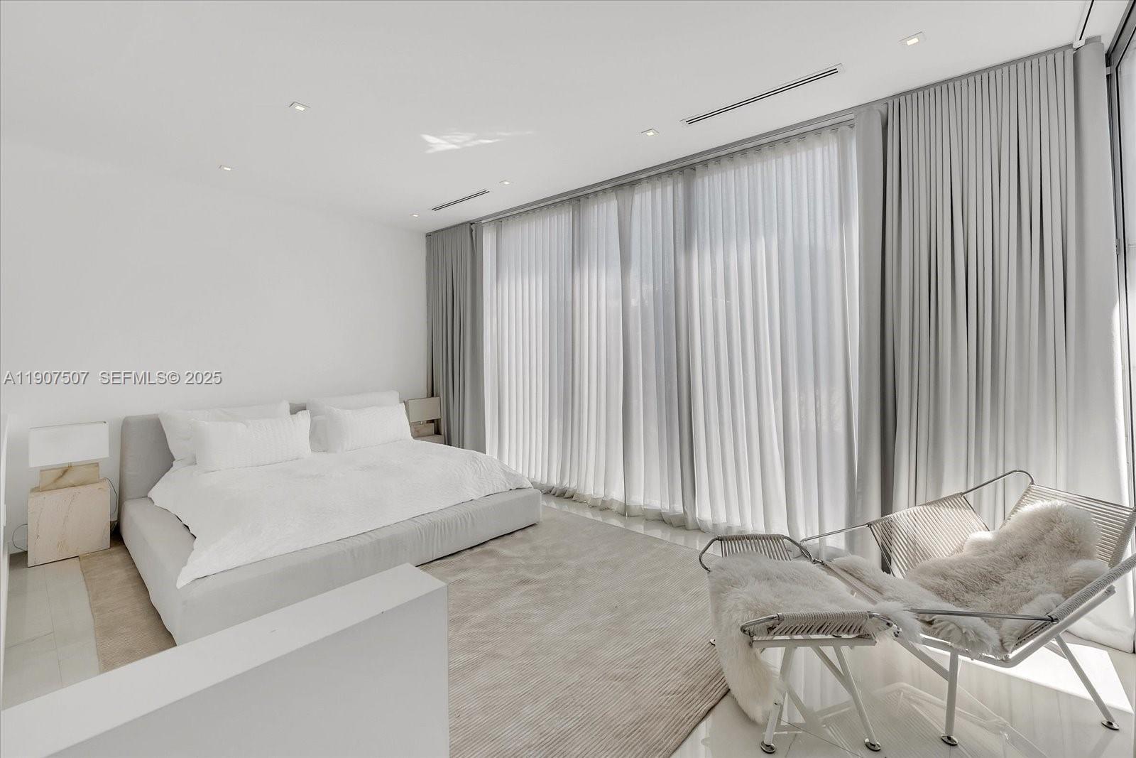 7830 Atlantic Way Miami Beach, FL 33141 - Photo 16 of 34 a living room with furniture and a window
