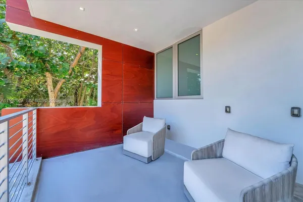a living room with furniture and a window