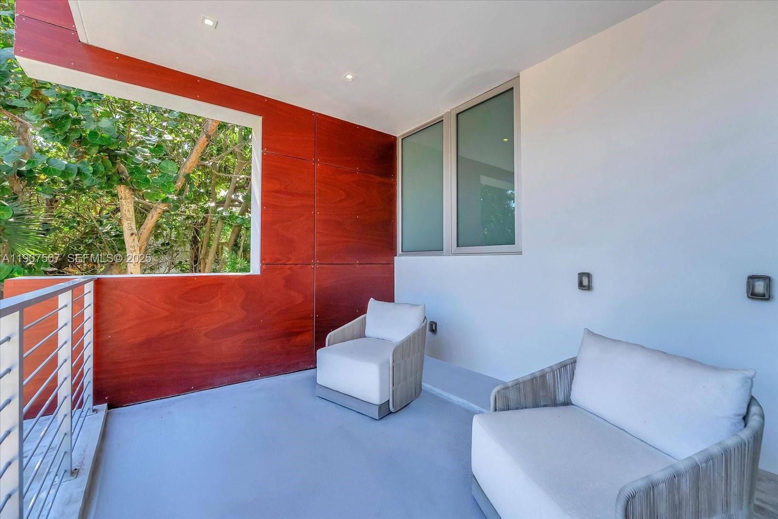 7830 Atlantic Way Miami Beach, FL 33141 - Photo 25 of 34 a living room with furniture and a window