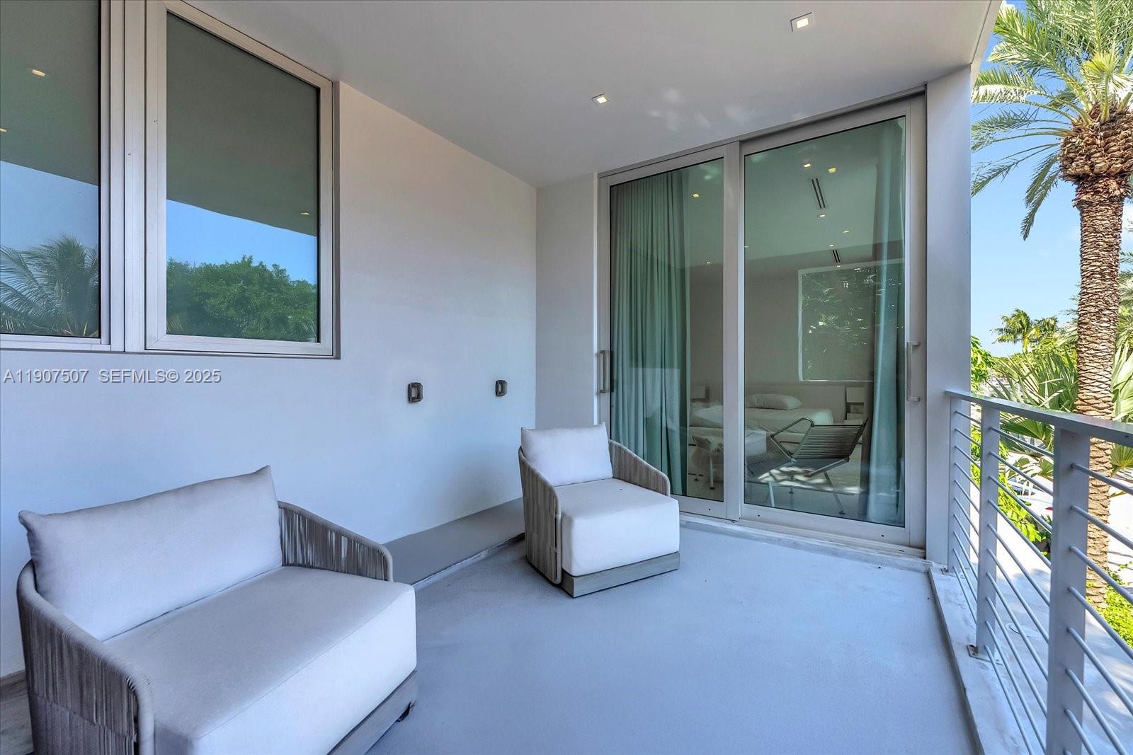 7830 Atlantic Way Miami Beach, FL 33141 - Photo 26 of 34 a living room with furniture and a garden