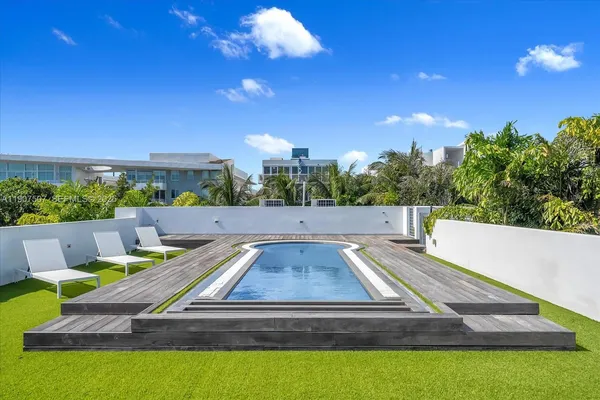 a view of a swimming pool with a patio