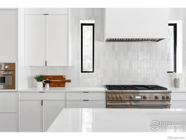 a kitchen with a stove and a cabinets