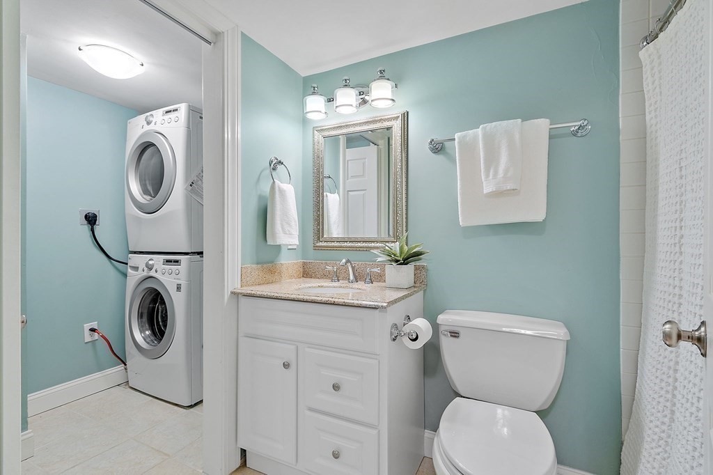 25 Holly Lane, Unit 2A Brookline, MA 02467 - Photo 13 of 34 a bathroom with a toilet sink and mirror