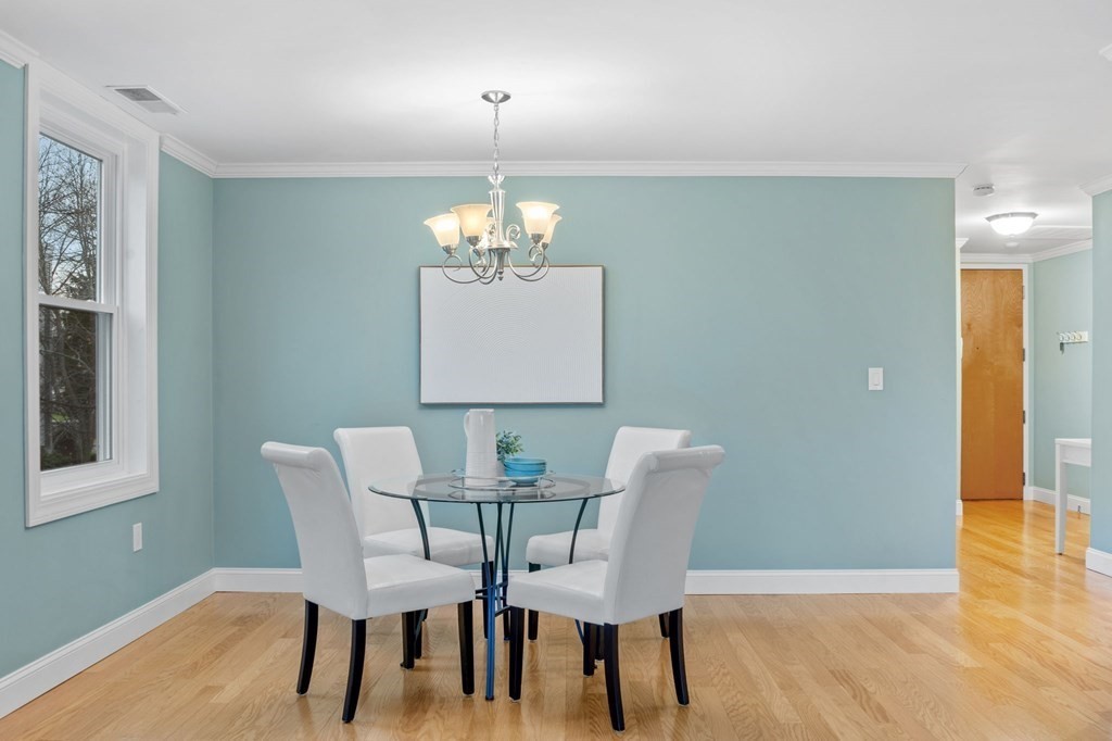 25 Holly Lane, Unit 2A Brookline, MA 02467 - Photo 20 of 34 a view of a dining room with furniture and wooden floor