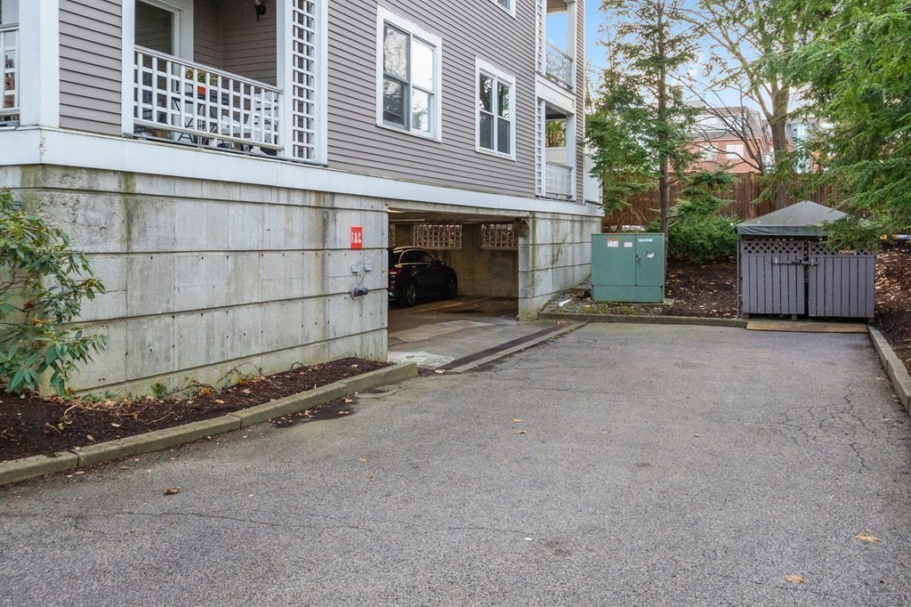 25 Holly Lane, Unit 2A Brookline, MA 02467 - Photo 27 of 34 front view of a house with a street
