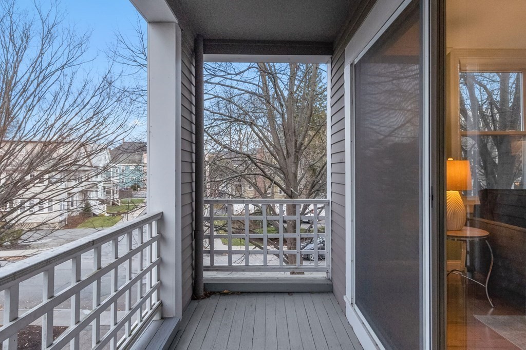 25 Holly Lane, Unit 2A Brookline, MA 02467 - Photo 6 of 34 a view of a balcony with wooden floor