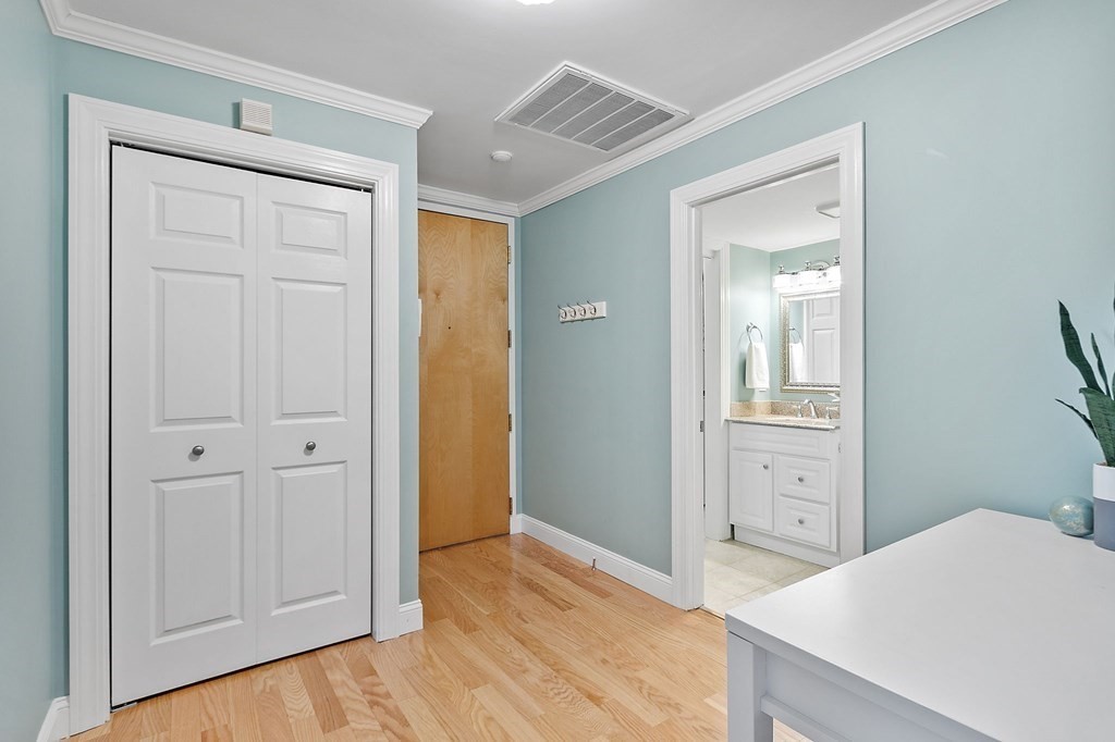 25 Holly Lane, Unit 2A Brookline, MA 02467 - Photo 9 of 34 a view of a bedroom from the hallway