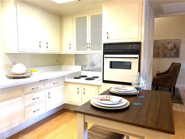 a kitchen with a sink and a stove