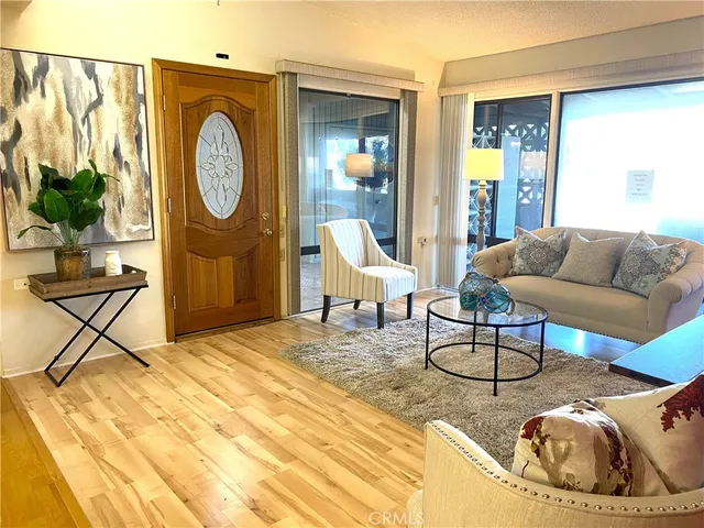 a living room with furniture and a clock